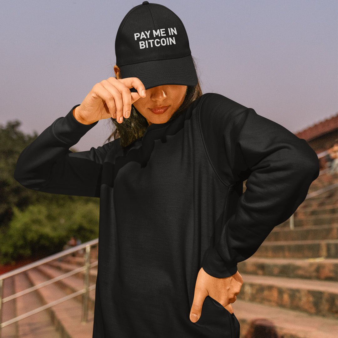 Bitcoin Accessories - The Pay Me In Bitcoin Hat worn by a female model. Front view.